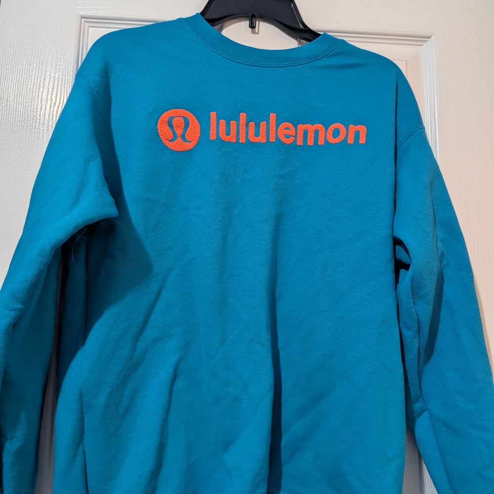 Lululemon Blue Sweatshirt with Orange Logo